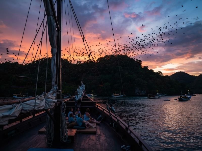 pulau kalong labuan bajo at dusk from a Komodo sailing boat